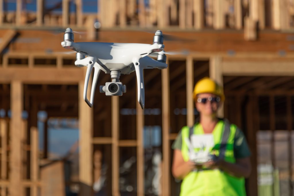 https://www.newangledrone.com/wp-content/uploads/2023/07/woman-construction.jpg